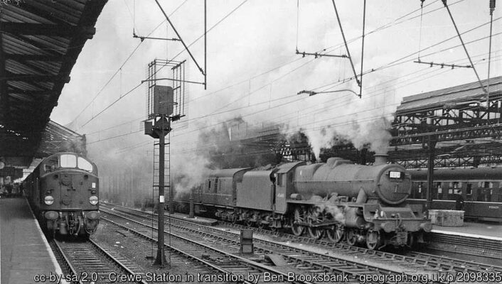 View northward on Platform 4, where English-Electric Type 4 Diesel No. D227 is heading the Up Midday Scot (13.30 Glasgow - Euston), while across at Platform 5 is LMS 'Jubilee' 6P 4-6-0 No. 45643 'Rodney' on the 16.50 Liverpool to Birmingham. Crewe station is wired up for the already electrified services to Manchester and Liverpool.