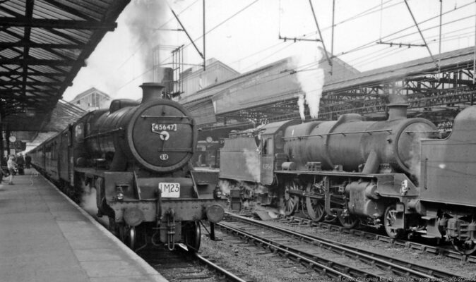 View northward along Platform 4 at Crewe: major junction on the WCML. Stanier 'Jubilee' 6P 4-6-0 No. 45647 'Sturdee' (built 1/35, withdrawn 4/67) is calling with the Saturdays Only 10.10 Edinburgh Princes Street - Birmingham New Street, while two locomotives coupled run on the Up Through from Crewe North Shed to take up southbound trains, the second being Stanier 5MT 2-6-0 No. 42954 (built 1933, withdrawn 2/67 - the last of its class). Main-line electrification had been in operation for a year, but so far only from Manchester Piccadilly.